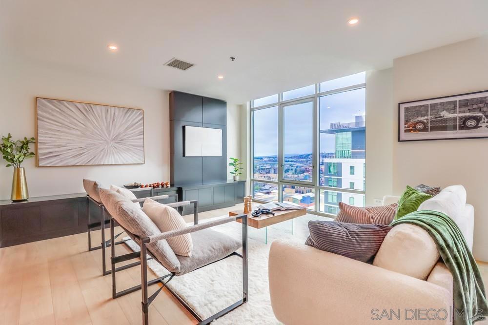 What a deal on this stunning 2 story penthouse in full service Acqua Vista with views! This building has it all including 24 hour valet parking, pool, spa, state of the art gym, 24 hour security and hotel like lobbies and concierge. This penthouse unit has been fully upgraded including euro style cabinets, quartz counters, SS appliances, designer tile and fixtures throughout, new laminate flooring and modern finishes. You will love the walls of windows in every room including the dual primary bedrooms upstairs each with an en-suite bath and multiple closets. Immerse yourself in downtown living with close proximity to the world class restaurants of Little Italy, the beautiful downtown waterfront, and Petco Park. Don't miss this one!