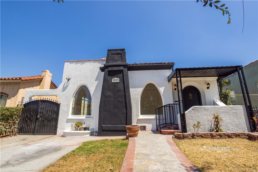 Breathtaking Vintage Spanish Home in Los Angeles! Nestled in the heart of the city, this fully remodeled 5-bedroom, 3-bath home blends timeless 1929 architecture with modern upgrades. From the classic tiled roof and arched doorways to the light-filled open floor plan, every detail radiates charm and elegance. Recent updates include new roof, plumbing, electrical, fresh paint, and beautifully renovated interiors. The spacious living room with fireplace, formal dining, and chef’s kitchen with custom cabinetry and quartz countertops make entertaining effortless. Retreat to the private master suite with spa-like bath and it's own fireplace, while additional bedrooms offer flexibility for family, guests, or office space. Outdoors, enjoy a lush backyard and large patio perfect for gatherings. The detached 2-car garage offers car storage or additional room for a private office or studio or ADU. Ideally located just 20 minutes from USC and BMO Stadium, with easy access to shopping, dining, and highways. Don't miss this rare opportunity to own a true Spanish Revival gem.