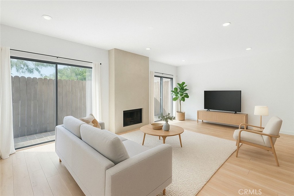 Experience the best of Santa Monica living in this sophisticated and spacious 2-bedroom, 2.5-bathroom townhome offering thoughtfully designed space in a quiet 4-unit building. The open-concept living area is filled with natural light and the chef’s kitchen includes an oversized black granite island and ample storage, with a convenient powder room on the first floor. Upstairs, two spacious bedroom suites feature cathedral ceilings, with the primary suite offering an office nook and walk-in closet. Additional highlights include remodeled bathrooms, central heating and air conditioning, in-unit washer and dryer, two side-by-side parking spots in a secure garage with additional storage, and recessed lights throughout. Located in the desirable Santa Monica school district, this home offers comfort, style, and convenience in one of LA’s most sought-after neighborhoods.