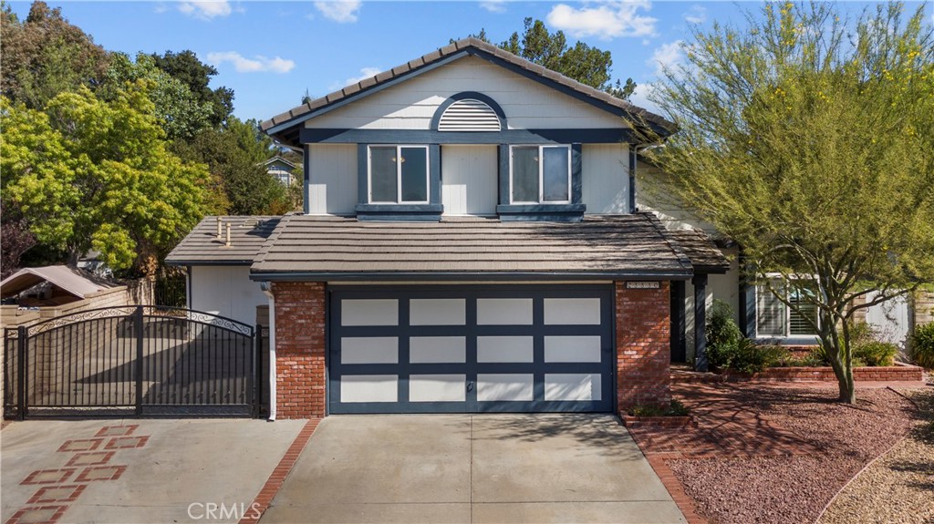 Welcome to Your Dream Home in Circle J Ranch! This stunning 4-bedroom, 3.5-bathroom home sits on an expansive 19,000+ sq. ft. lot in the highly desirable Circle J Ranch community of Santa Clarita. Located on a quiet cul-de-sac, this property offers a rare blend of privacy, space, and flexibility – with no HOA! Step inside to soaring vaulted ceilings and a light-filled living space that immediately feels warm and inviting. The thoughtfully designed layout features a secondary primary suite/Next Gen space perfect for multi-generational living, guests, or a private home office. The kitchen opens to the family room and offers plenty of counter space, cabinetry, and natural light – making it a perfect gathering spot. Multiple living areas, including a sun-filled bonus room, provide room for everyone to spread out and enjoy. Upstairs, you’ll find the spacious primary suite with vaulted ceilings and views of the backyard, along with additional well-sized bedrooms. Outside, the park-like backyard is a true highlight – complete with mature trees, a covered patio, and plenty of space for RV or boat parking. Whether you dream of a pool, garden, or outdoor entertaining space, this oversized lot gives you endless possibilities. This home is a rare opportunity to enjoy the charm and serenity of Circle J Ranch with all the space you’ve been searching for. Schedule your private showing today and see why this property is the perfect place to call home!