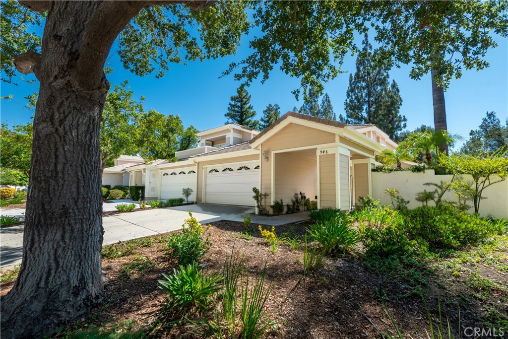 Welcome to 946 Blue Mountain Circle, an incredibly charming and beautifully updated residence tucked behind the gates of the coveted Braemar community in Westlake Village. This warm and inviting two-story home features 3 bedrooms and 2.5 bathrooms, including a spacious primary suite located on the main level. Step inside to discover soaring high ceilings, rich wood flooring, a tastefully remodeled kitchen, and an open-concept living space filled with natural light. The backyard is a private sanctuary, complete with lush landscaping, custom hardscape, and a serene garden setting perfect for entertaining or relaxing in total privacy. Residents enjoy access to a resort-style pool, spa, and clubhouse within the gates. The home is also just a short stroll to nearby tennis courts, a playground, volleyball court, and scenic hiking and biking trails. Truly a special offering!