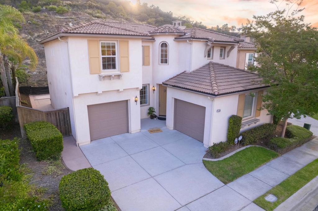 Tucked into peaceful gated Belleza this spacious home offers a rare blend of comfort, privacy, and long-term flexibility. Set at the back of the community with no rear neighbors, the home enjoys a quiet setting with a scenic foothill backdrop. High ceilings & large windows fill the home with natural light & views of palm trees & nearby hills. Within the last 3 years, sellers have made thoughtful upgrades: engineered hardwood floors throughout most of the home, new roof underlayment, SS appliances, updated lighting, window treatments, safety updates—creating a solid foundation for the next owner to personalize. Layout includes a full bath/bed on the main level—ideal for guests, office, or potential junior ADU. Kitchen and daily dining area offers generous storage and garden & mountain views. Adjoining living room features gas fireplace & large windows framing the outdoor space, and the formal dining room offers a welcoming spot for gatherings. Upstairs, two flexible spaces enhance everyday living: an alcove and a primary suite retreat—perfect for a reading nook, nursery, gym or workspace. Primary suite features a wall of windows with nature views and ensuite bath with dual sinks, soaking tub, separate shower, private water closet & spacious walk-in closet. 2 additional bedrooms, a shared hall bath, and a large laundry room complete the upper level. Low maintenance backyard includes BBQ island, space for gardening and dining al fresco, and a spa-ready pad with 220V hookup. Other highlights: 2 direct-access single-car garages and whole-house fan. HOA maintains the front yard & pvt community park. Located just down the street from CSUSM & Sprinter station, this home is perfectly positioned for campus life, easy commuting & quick access to North County's shops, restaurants, and events. Move right in and enjoy the comfort, calm, and convenience of life in the heart of San Marcos!