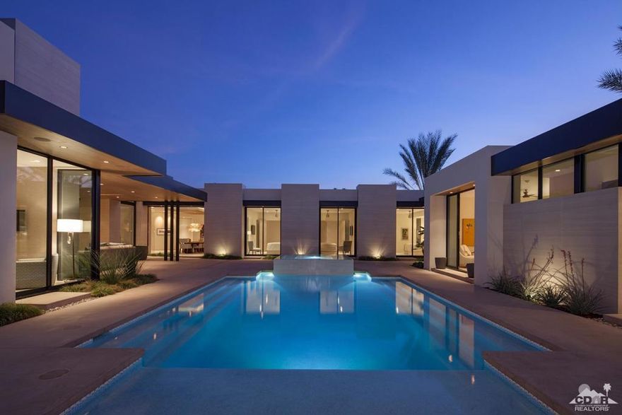 A newly completed residence graces a lot that borders the 2nd Hole of the Desert Course offering an appealing outlook down the emerald green fairway & beyond to the picturesque peak of Mt. Eisenhower amid the Santa Rose Mountains. Designed by Architect Gordon Stein of Mox Design, the contemporary styling home exudes the finest of a mid-century modern design. Completed by Jody Jones Construction in 2018. The floor plan includes three guest suites w/ private bath, exceptional master suite & detached casita. Gated courtyard opens to the first of two outdoor entertaining venues and features the large swimming pool with infinity-edge spa & cabana swim-shelf, outdoor seating area w/ fireplace and overhead radiant heaters. The second venue is accessed via motorized retractable doors off the great room & overlooks the golf course w/ relaxed seating. Offered Furnished Excluding Art