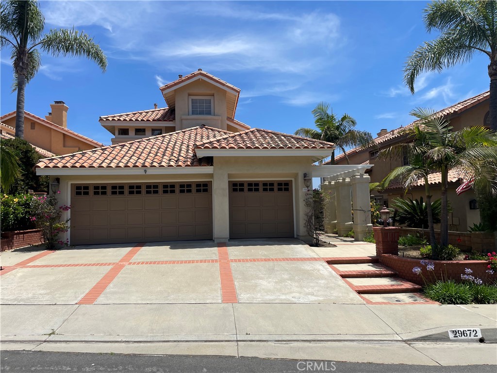 Impressive Location! beautiful home located in the prestigious area of Portofino at Niguel Summit on a single loaded street with panoramic mountain, city lights to ocean views. This bright and spacious home features a highly desirable open floor plan with 4 bedrooms including one downstairs, 3 bathrooms, totaling 2,585 square feet of comfortable spacious living space, three car garage. As you enter, you’re instantly greeted by an impressive grand staircase with high volume ceilings in living room, formal dining room and an array of windows allowing in an abundance of natural light. Kitchen is complete with a 5 Burner gas stove, recessed lights, spacious breakfast, lunch nook and bar seating areas which flow into the family room with a beautiful custom fireplace. This leads to an entertainer’s delight: a backyard with a putting green with panoramic views, ample space making it a perfect melding of volume, warmth, indoor-outdoor functionality for everyday living and entertaining! Additional appointments include: brand new elegant wide-laminate wood flooring installed throughout the entire house, brand new carpet and baseboards. On the second level, you’ll find a spacious primary suite with tall ceilings, extensive views, an ample walk-in shower, tub, dual vanities, large walk-in closet. Two spacious secondary bedrooms complete the upstairs. Brand new tile flooring in the bathrooms upstairs. Inside laundry room with sink in it. A lot of storage throughout the whole property. Close to everything, convenient location in Laguna Niguel, close to shops, restaurants, movies, Award-winning schools and a short drive to ocean.