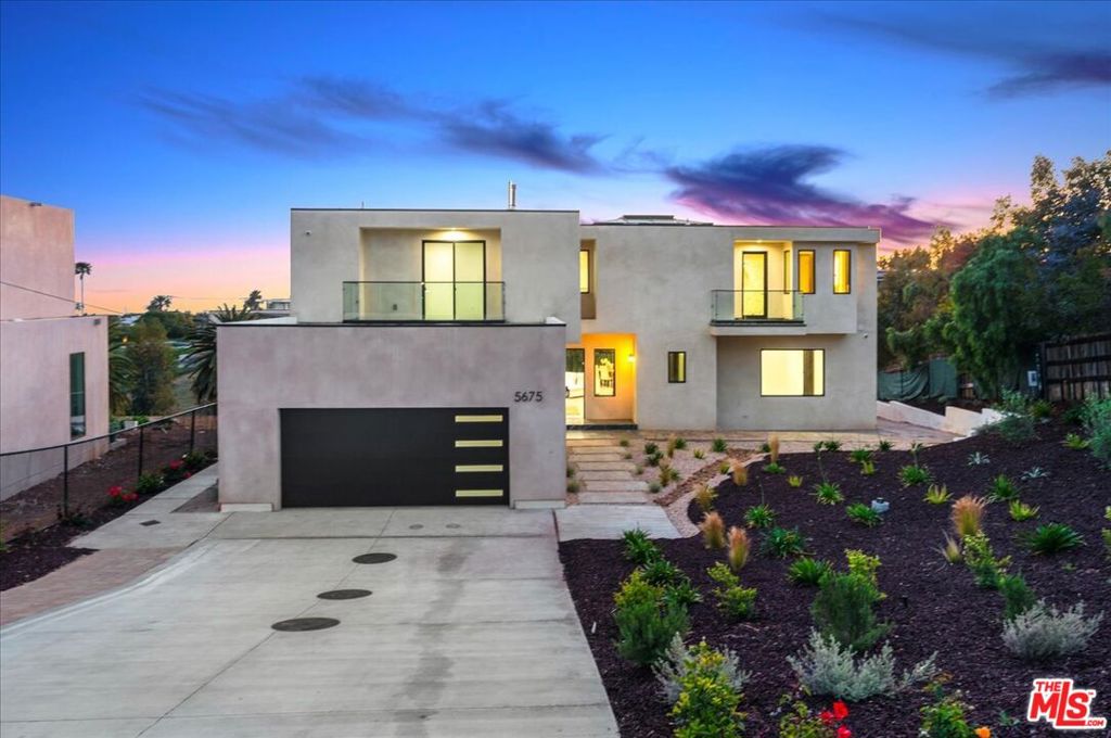 Introducing a rare opportunity to own a newly constructed architectural estate in the heart of Malibu Park, situated on a private knoll on a desirable cul-de-sac street. Designed to capture the natural beauty of its surroundings, this stunning five-bedroom, five-and-a-half-bathroom residence offers panoramic ocean, canyon, and mountain views from nearly every room. Set behind a gate on a half-acre of fully fenced, park-like grounds, this home offers privacy, serenity, and space for equestrian use or an additional ADU.The residence spans 3,848 square feet of interior space, complemented by 1,228 square feet of expansive decks and balconies, and a 555-square-foot garage, plus two basement-style rooms totaling another 383 square feet. Enter through a bold and prestigious oversized front door framed by Italian stone walls and a granite porch, leading into a sun-filled open layout adorned with oak hardwood floors and solid oak interior doors throughout. A wall of Western sliding glass pocket doors connects the main living space to a Brazilian Tigerwood entertainer's deck, making indoor-outdoor living seamless and spectacular.The chef's kitchen is a culinary masterpiece, featuring top-of-the-line Thermador appliances, a 6-burner stove with double ovens, oversized island, and Carrara Marble countertops perfect for hosting guests or preparing meals with ease. The home's five bedrooms all feature en suite bathrooms, offering comfort and privacy for family and visitors. Two bedrooms are located on the main floor, while three including the luxurious primary suite are upstairs.The primary retreat is a true sanctuary, boasting dual ocean-view balconies, a jetted tub, oversized marble shower, private sauna, and Marvin sliding doors that invite in the sea breeze. A striking glass ceiling above the central staircase and upper hallway floods the home with natural light. For added convenience, the residence includes a Nitto residential elevator, ensuring easy access across all levels. Every inch of the home has been thoughtfully crafted for modern living. Each room is prewired for televisions and high-speed internet, and the exterior corners are prewired for a complete security camera system. Additional highlights include spa-inspired bathrooms with full stone finishes throughout. The outdoor spaces are equally exceptional. In addition to the entertainer's deck, the property features a sparkling pool and spa, a large driveway with ample parking, an enclosed courtyard, and lush landscaping. Zoned for horses and space for an ADU, this home offers the rare blend of luxury, space, and flexibility in one of Malibu's most sought-after locations. Conveniently located just minutes from Zuma Beach, Trancas Country Market, Point Dume, Westward Beach, equestrian trails, scenic hiking paths, and top-rated Malibu schools, this is the ultimate property to experience the spirit of coastal Malibu living.