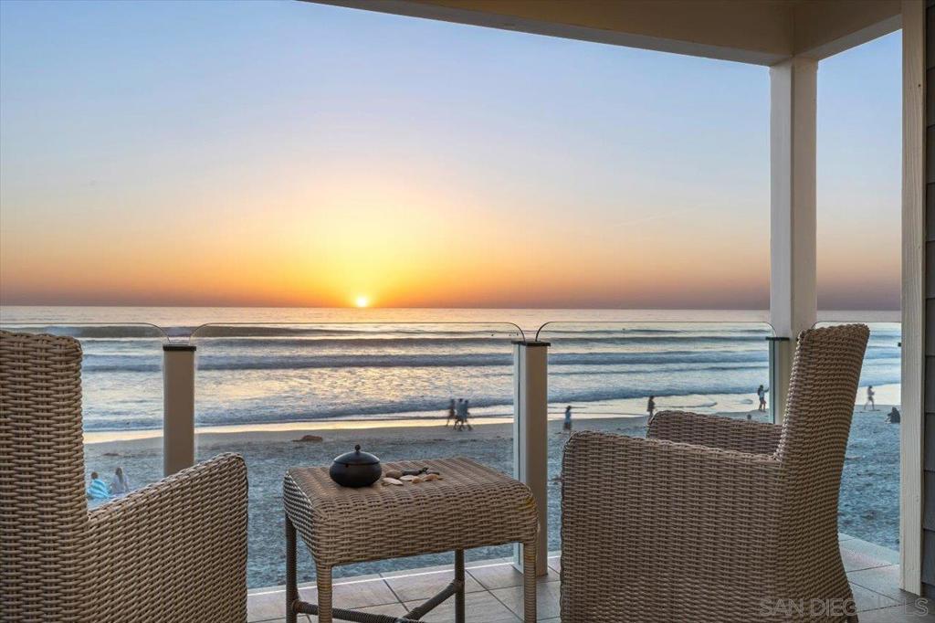 Incredible opportunity to enjoy Ocean Front living at its best. Professionally designed Beach Home! Gorgeous Traditional/Modern design with master suite upstairs to embrace the sights and sounds of the surf. Steps to the Village for dining and shopping. Defined by the exquisite detailing throughout the 4 bedrooms / 4 bath home, this magnificent retreat lives Brand NEW w/amenities such as iPad-controlled one touch lighting & Sonos surround-sound. Exceptionally rare in more ways than one, the 3-Car Garage w/ 4 additional parking spaces is a prize to behold. Located on the PREMIER block on Del Mar's SAND, even the surrounding utility poles and wires have been ungrounded. Easy 5 minute stroll to nearby acclaimed Dining / Shopping of Old Del Mar Village with rolling ocean waves always greeting you upon your return home.