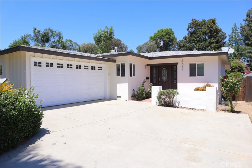 Gorgeous 3 bedroom 2 bath family home in one of Woodland Hills' finest communities. Freshly painted in and out, newly refinished hardwood floors, recessed lighting throughout, newly remodeled bathrooms, central heat and air, a cozy corner fireplace, a well appointed kitchen and a separate laundry room. Outdoor amenities include a very private covered patio/deck overlooking a big fenced back yard, a two car garage, and a large concrete drive way for additional off street parking. This coveted location is close to shopping, restaurants, and right down the street from the award winning Woodland Hills Elementary School. Just a short distance to the rapidly developing Warner Center business and entertainment center providing world class restaurants, a state of the art movie theater, and shopping for every budget. Near all of the opportunities of the big city while living in a quiet suburban neighborhood.