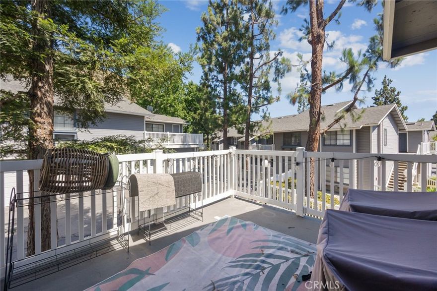 Home is where comfort meets connection—and you’ll instantly feel that at 1760 Shady Oaks Court, nestled in the desirable Crystal Canyon Community of Azusa. This beautifully maintained upper-level residence delivers an ideal combination of seclusion and natural light. Step through the door and you’re welcomed by dramatic vaulted ceilings, expansive windows, stylish ceiling fans, recessed lighting, durable vinyl flooring, and a spacious, open-concept design that feels instantly inviting. The sunlit, updated kitchen strikes a timeless balance with crisp white cabinetry and rich granite countertops, seamlessly flowing into the dining and living areas—perfect for both entertaining and everyday living. Just beyond, a private patio shaded by mature trees invites you to dine al fresco, host friends, or simply enjoy a peaceful moment outdoors. The thoughtful floor plan includes a convenient half-bath for guests, indoor laundry, and a flexible den that easily transforms into a second bedroom, home office, or creative studio. The generous primary suite offers room to unwind, ample closet storage, and a private bathroom complete with a full tub/shower and extended vanity. Residents of Crystal Canyon enjoy access to resort-style amenities including a sparkling pool, relaxing spa, and tennis court—all set against the scenic foothills and located just minutes from the heart of Azusa. This isn’t just a condo—it’s the beginning of something special. Discover everything 1760 Shady Oaks Court has in store for you!