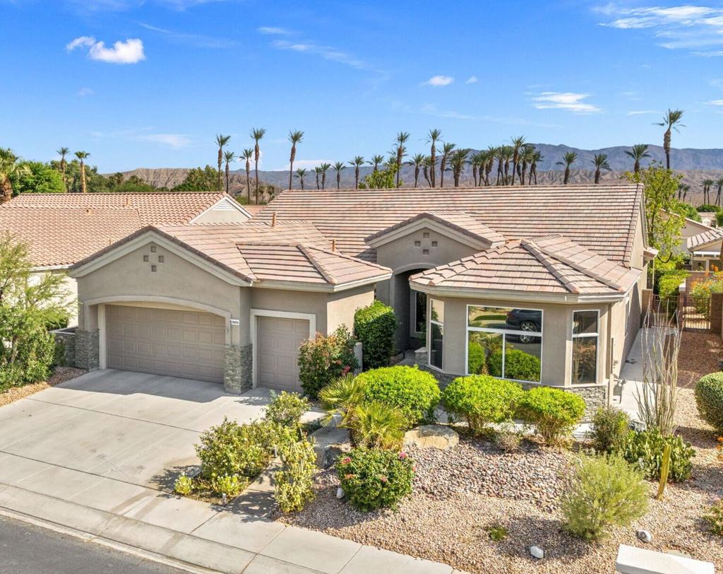Located in the best 55+ community in the valley, Sun City Palm Desert, this Monterey is one of the favorite models. This home has fabulous curb appeal, with newer exterior paint, beautiful satcked stone wanescot, and double glass entry doors. The living area has new paint, 20X20 offset tile floors, and the bedrooms have new carpet. There are plantation shutters throughout and upgraded lighting fixtures. This is an open floor plan with high ceilings and lots of light. The kitchen has Corian counters and an accent granite slab island, original upgraded cabinets, recessed lights, and stainless appliances. The living room has a built-in media center, and is open to the kitchen, dining room, and the bonus game room. The master suite has a custom headboard/dresser and a door out to the enclosed patio. The bathroom has a double vanity, a soaking tub, a walk-in shower, and a custom walk-in closet. The large guest bedroom is on the opposite end of the home and shares the 2nd full bath with the office/den. There is a powder bath off the kitchen and the laundry room includes the washer and dryer and has a convenient folding table. The garage has epoxy floors, plenty of storage cabinerts, and a NEWER A/C SYSTEM. The backyard is very private and has easy maintenance tropical/desert landscaping. This home is a gem, not to miss. SUN CITY PALM DESERT IS ALL ABOUT LIFESTYLE!! It has many clubs, activities, amenities, and low HOA dues. Play at 2 championship 18-hole golf courses and practice facilities, pickle ball, tennis, softball, bocci ball, an 18-hole miniature golf course, an honor library, arts and crafts, a ballroom for special entertainment, and 4 saltwater pools kept at 87 degrees with hot tubs. Enjoy 2 great restaurants, a martini/coffee bar, and even a post office. There is a newly renovated classy indoor/outdoor bar with fire tables to enjoy the awesome views and our beautiful desert weather.