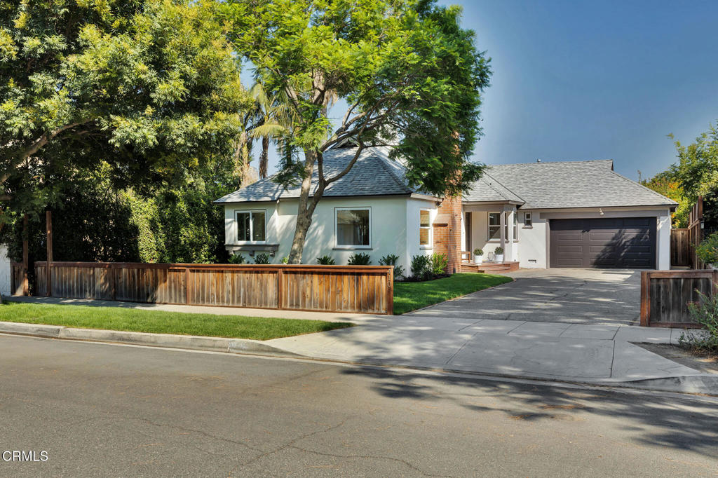 House & Guesthouse in the coveted Burbank Rancho. Tucked into a graceful bend of a tree lined street in the heart of Burbank's beloved Rancho neighborhood, this rare offering includes both a character rich main home and a separate guesthouse--ideal for multi-generational living, home office, creative space, or ...? The 3 bedroom, 2 bath main residence blends original charm with thoughtful updates, featuring remodeled bathrooms, a refreshed kitchen (2020), and a finished garage that flexes beautifully as a home office, gym, studio, or theater. Just across the garden path, the 1 bedroom, 1 bath guesthouse evokes classic Rancho character with warm wood-paneled walls and romantic Spanish tile underfoot. Significant upgrades include: new roof (2021), dual-pane windows (2020), replaced sewer line (2018), fresh interior and exterior paint (2025), new stucco (2025), and brand new landscaping for picture perfect curb appeal.In a neighborhood known for its equestrian roots and close knit community, you'll hear the occasional neigh of a nearby horse while being just minutes from Disney Studios, the LA Equestrian Center, Griffith Park, and major freeways.This is a rare chance to own in one of Burbank's most sought after enclaves. Call today for a private showing.