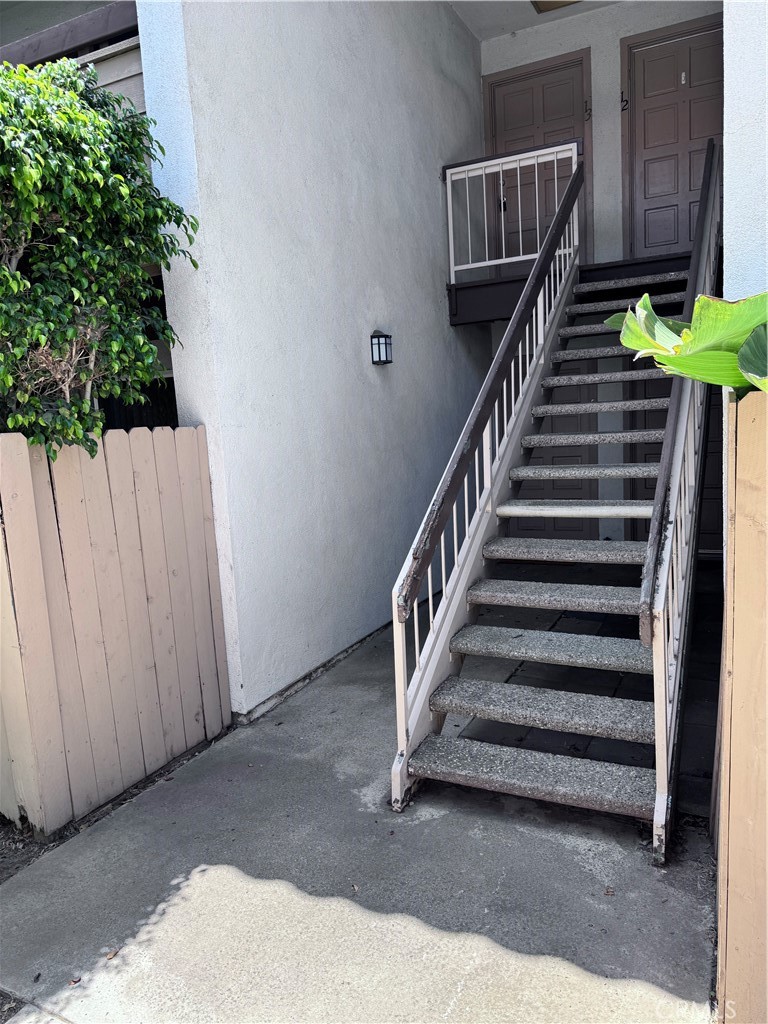 Do It Yourself Special! Opportunity to make it your home, your way! (Not remodeled unit). This is an upstairs unit in the gated Woodside Village complex. 2 bedrooms and 2 bathrooms. The master bedroom connects to private bathroom with shower stall (brand new shower valve was installed by professional plumbers last month June 2nd). The convenient hallway bathroom has bathtub and is across the 2nd bedroom. Floorplan offers eating area next to kitchen. Living room has sliding patio door to private balcony. HOA just installed new gates/fence. This unit is by Greenville and Sunflower. Wrong entrance if at MacArthur and Sunflower. Also can enter main gate on Sunflower Ave (after enter, will see main pool, walk on left pathway and will see Building G, look for nearby Building H, unit 13). Can walk to Super King supermarket and McDonalds. Convenient location close to freeways and the famous South Coast Plaza and nearby Outlets.