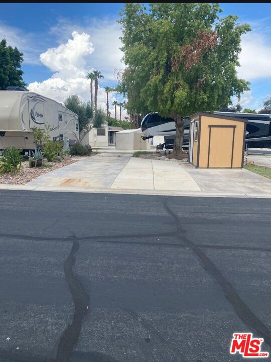 This is a lot within the community that is close to one of the satellite that has a pool, jacuzzi, laundry and mail. It is also close to the entrance of the community. It contains a beautiful shade tree, on the south side of the lot, which provides shade for the afternoon sun. The back sits up against a greenbelt that houses several of the RV lots in the park. The area prefers for the lot to stay a RV lot for RV's and trailers. This all located in a 55+ community that has a 3 par golf course, chipping green, putting green, 9 hole mini golf, pickleball and tennis courts, bocce ball, an indoor shuffleboard courts, 2 clubhouses with pools and jacuzzies and an additional 4 satellites with pool, jacuzzies and mail boxes. This is all within a 24 hour gate guarded community of 801 lots, that consist of a combination of Park Models and RV lots, where you own the land. The resort has a limit of 270 day occupancy. It is a perfect place to spend your holidays in the sunshine.