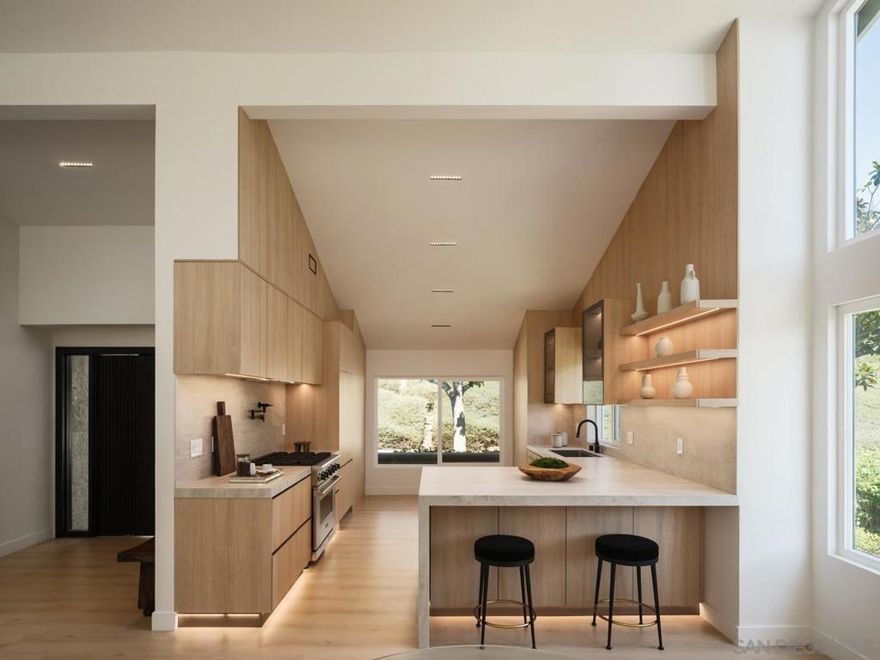 This one-of-a-kind, fully remodeled Mount La Jolla home offers a stunning blend of modern design, luxury finishes, and thoughtful craftsmanship. Every detail has been elevated, from custom wood cabinetry that adds warmth and elegance to clean architectural lines and sleek black hardware that create a contemporary edge. LED accent lighting throughout highlights the home’s unique features. A loft-style bedroom adds versatility and character to the open split-level design.  The chef’s kitchen is outfitted with top-of-the-line Viking and Fisher Paykel appliances, seamlessly integrating performance with style. Custom closets throughout the home provide both sophistication and function, and expansive western views capture San Diego sunsets in perfect clarity.  Set within the coveted Mount La Jolla community, residents enjoy resort-style amenities including multiple pools, tennis courts, a clubhouse, and fitness center, all surrounded by beautifully landscaped grounds. Just minutes from La Jolla’s coastline, upscale village dining, and top-rated schools, this home is a rare opportunity to own a meticulously redesigned sanctuary in one of Southern California’s most desirable neighborhoods.
