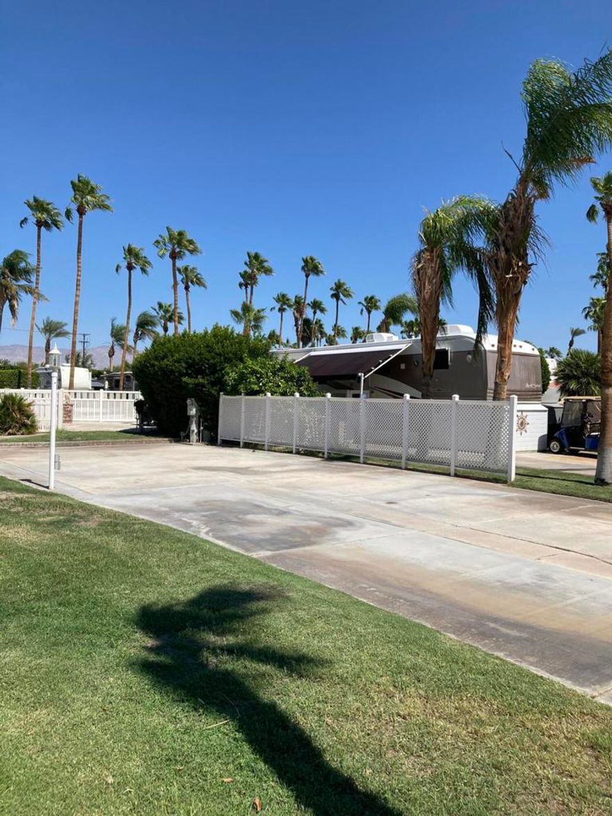 This outstanding lot presents a unique opportunity for personalization. Situated in a prime location just steps to the pool, spa, laundry and full restroom facilities. Owners will appreciate the lot's close proximity to the front entrance, allowing for effortless entry and exit, while its strategic placement near La Palma clubhouse offers convenient access to a restaurant, gym and various indoor activities. Lot 65 also has a fairly large grassy area making ideal for pets.