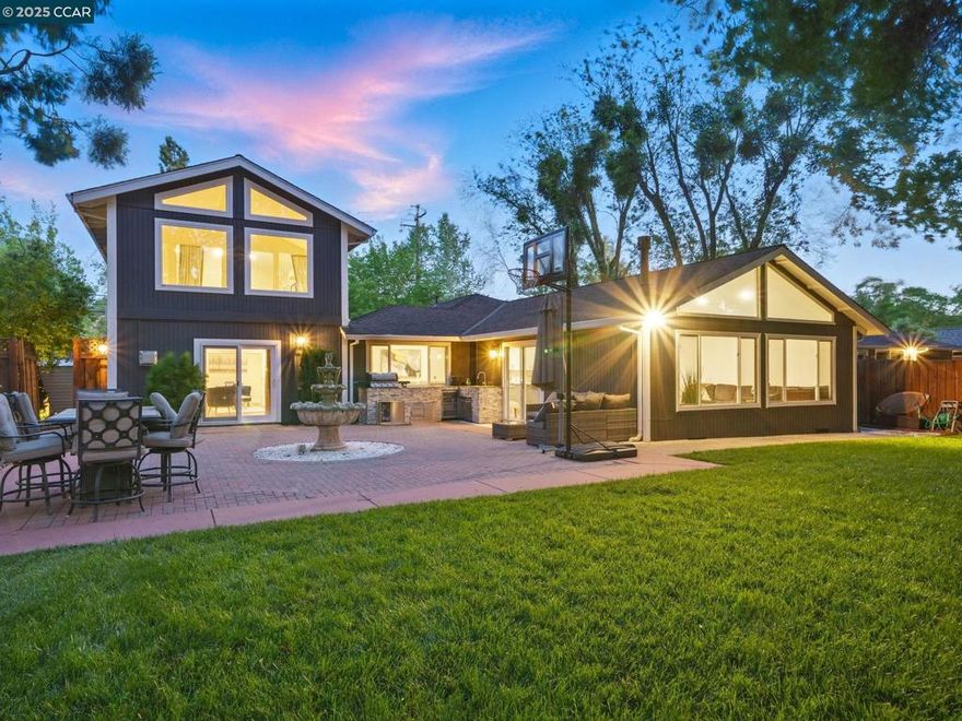 Experience exceptional living in this fully renovated, designer-crafted residence in Walnut Creek’s prestigious Parkmead neighborhood. This 5-bedroom, 3-bathroom home offers 3,152 sq ft of elegant living space on a flat 0.25-acre lot—just a 5 minutes walk to downtown, top schools, and upscale amenities. Soaring vaulted ceilings and expansive dual living rooms create an airy, grand atmosphere throughout. A formal dining room and open-concept layout are ideal for both intimate gatherings and entertaining at scale. The custom chef’s kitchen is the heart of the home—complete with a large center island, premium stainless steel appliances, and bespoke cabinetry. It flows effortlessly into the family room and dining area for seamless everyday luxury. The primary suite is a tranquil retreat featuring vaulted ceilings, dual vanities, and a spa-style walk-in shower. Smart home integration with Alexa, wide-plank flooring, and high-end finishes elevate the experience throughout. Outside, enjoy resort-style living with a built-in BBQ, wine refrigerator, and sink, surrounded by lush, professionally landscaped grounds. The generous backyard offers space for entertaining, relaxation, and recreation.This is a rare opportunity to own a turnkey luxury residence in Walnut Creek.