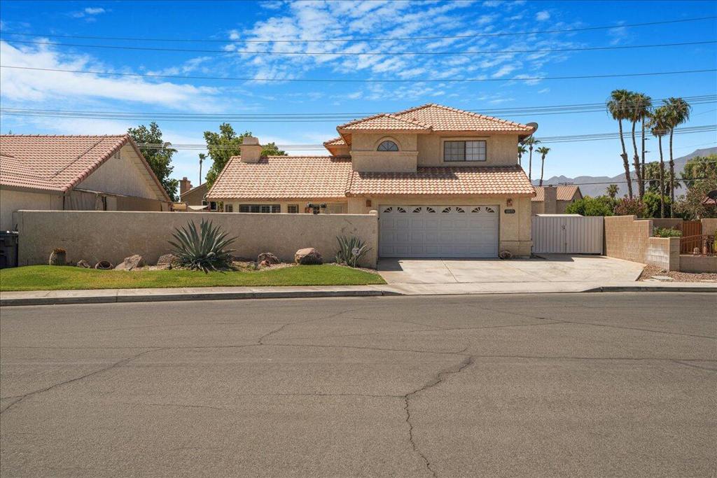 Experience the ultimate in outdoor living with this stunning home, featuring an extraordinary front-yard pool and spa, perfect to create lasting memories, entertaining and for relaxation. This charming home offers 3 bedrooms, a den/office downstairs with a closet that could be used as the 4th bedroom, 2.5 bathrooms. The cozy family room and a formal living that offers comfort and style along with beautiful wood shutters to let the natural light in. The open concept kitchen is spacious, offers stainless steel/ black appliances and white tile Countertops! The beautiful French Doors in the dining area offer a stunning reflection of the covered patio and it's well-kept garden. All appliances, including the refrigerator, washer, and dryer, plus a pool table, are part of the sale. Enjoy the best of the Valley with this home's prime location near major attractions from the world famous Coachella and Stagecoach festivals, as well as local Casinos, Schools, Restaurants and shopping destinations!