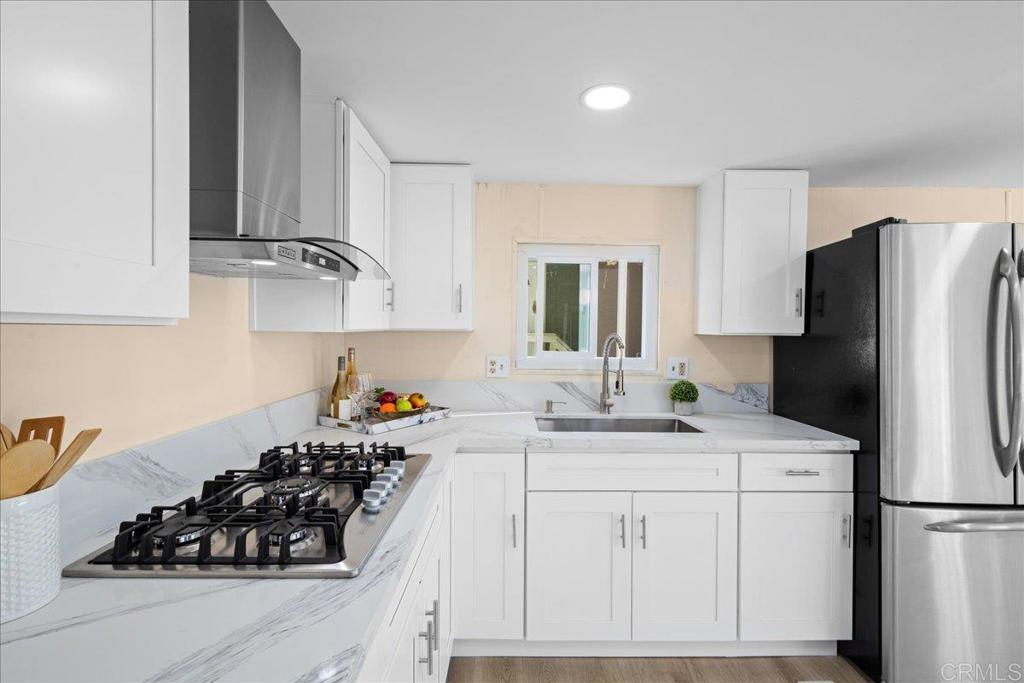 PRICE REDUCTION!! Great opportunity for new buyer! Welcome to your new home in the desirable ALL-AGE gated community of Summit Ridge Resort. This beautifully renovated 1 bedroom, 1 bathroom manufactured home offers 516 Sqft of modern living with recent upgrades throughout. The open and spacious floor plan is filled with natural light, creating a warm and inviting atmosphere. The kitchen has been completely updated with new cabinets, quartz countertops, stainless steel gas cooktop, range hood, sink, and fixtures. Additional improvements include brand-new windows, new flooring, recessed lighting, fresh paint inside and out, and a new ceiling in the living and kitchen areas. The bathroom has been upgraded with a new vanity cabinet and modern tile finishes. Convenient features include a stackable laundry area and a 2-car carport for medium-sized vehicles. The Summit Ridge Resort community offers fantastic amenities including two sparkling pools, multiple laundry facilities, a playground, and secure gated access. With low space rent of $990/month and a location close to major freeways, excellent schools, shopping, and downtown San Diego, this home provides both comfort and convenience. Don’t miss out on this incredible opportunity to own in San Diego at an affordable price!