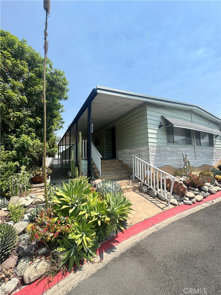 Light & bright 2 bedroom/2 bath manufactured home in the highly desired Cedar Hills Estates Community. This 1050 sq ft home has two large bedrooms, air conditioning, private back flagstone patio, 2-storage sheds, attached carport with space for 3 cars. Family room open to dining room, front bedroom opens to side porch, separate laundry room with utility sink. Refrigerator, stackable washer/dryer & dishwasher included. Water, Gas & Electricity Included. This all ages community association includes, pool, spa, recreation center, gym, tennis court, putting green, and library along with monthly social functions. Convenient location to great shopping, dining, parks and entertainment options. Conveniently located near Cal State Fullerton and The Brea Mall and close to the 57 Freeway. Call to schedule a showing!