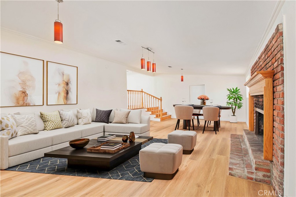 Welcome to a home that offers both comfort and possibility in the heart of Encino Park. This lovingly updated 4-bedroom, 2.5-bathroom residence features nearly 2,500 square feet of inviting living space on an oversized lot—over 1,000 sq ft larger than most in the neighborhood. From the moment you step inside, you’ll feel the warmth of its bright, open layout, complemented by brand-new flooring and thoughtful touches throughout. The main living area includes 3 generously sized bedrooms and 1.5 baths, along with a spacious, light-filled family room centered around a classic brick fireplace—perfect for cozy evenings. The kitchen, with its cheerful breakfast nook, is ideal for casual mornings or catching up over coffee. There’s even space to convert the powder room into a full second bath, offering flexibility to grow with your needs. Separate living quarters with its own exterior entrance provide the perfect retreat—whether you're looking for private guest accommodations, multigenerational living, or a peaceful work-from-home setup, this versatile space adapts to your lifestyle. Whether you’re seeking a spacious single-family home, a multigenerational layout, or an income-producing opportunity, this property is uniquely positioned to deliver. Plans have already been submitted to the city to reconfigure the layout into three separate units—with the potential to add a fourth by converting the existing carport—all without expanding the home’s current footprint. With the ability to easily divide the main residence from the additional units, you can begin generating rental income right away. With tasteful upgrades throughout, a brand-new roof installed in 2024, SB9, ADU potential and thoughtful planning for long-term value, this one-of-a-kind property is a must-see for anyone looking to live, invest, or both in the heart of Encino.