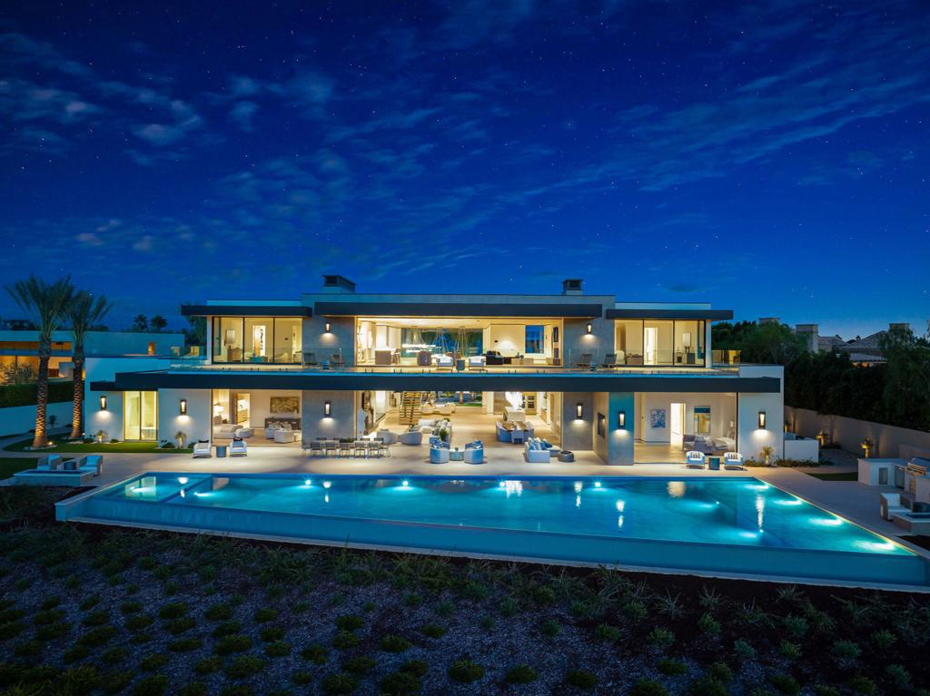 Welcome to The Madison Club. This stunning home offers 8 bedrooms, 9 full baths, and 4 powder rooms, spread over a generous 17,360 square feet of living space perfectly positioned on a 1.1 acre lot overlooking the signature 7th green of the Tom Fazio designed golf course. The bright open floor plan, temperature-controlled wine room, a gourmet kitchen, and expansive bar area, and state-of-the art home theater, make this home a perfect place for those who love to entertain. The outdoor living area is equally impressive, with a large zero-edge pool and spa, a fire pit, and separate barbecue zone. The property includes a 3-bedroom detached guest house including a living room, a kitchen, and a courtyard pool, providing privacy and comfort for your guests. Don't miss the chance to own your piece of paradise in one of the most prestigious and exclusive communities, The Madison Club.