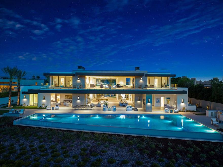 Welcome to The Madison Club. This stunning home offers 8 bedrooms, 9 full baths, and 4 powder rooms, spread over a generous 17,360 square feet of living space perfectly positioned on a 1.1 acre lot overlooking the signature 7th green of the Tom Fazio designed golf course. The bright open floor plan, temperature-controlled wine room, a gourmet kitchen, and expansive bar area, and state-of-the art home theater, make this home a perfect place for those who love to entertain. The outdoor living area is equally impressive, with a large zero-edge pool and spa, a fire pit, and separate barbecue zone. The property includes a 3-bedroom detached guest house including a living room, a kitchen, and a courtyard pool, providing privacy and comfort for your guests. Don't miss the chance to own your piece of paradise in one of the most prestigious and exclusive communities, The Madison Club.