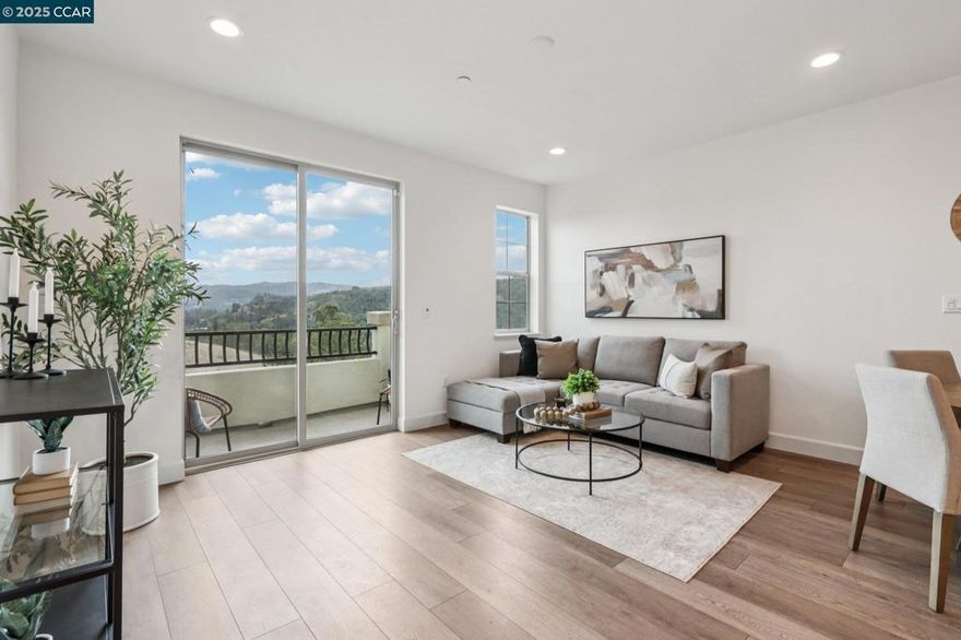 Tucked against open space with stunning views of the Martinez hills, this beautifully updated townhouse blends modern design, thoughtful functionality, and an unbeatable location. Situated near coffee shops, restaurants, shopping, and a movie theater—with easy freeway access—this home offers both comfort and convenience. Solar panels and an energy-efficient ECOBEE system are an added bonus. The entry level welcomes you with a functional landing area and direct access to a spacious tandem garage featuring an organized built-in storage system for bikes and more. The main level is an entertainer’s dream, showcasing a stylish island kitchen with sleek quartz countertops and stainless-steel appliances. The adjacent family room is open, light-filled, and flows seamlessly onto a private balcony with sweeping views of the surrounding hills. A third bedroom on this level offers flexibility—perfect for a home office or guest room. Upstairs, the primary suite is a true retreat, featuring a custom ELFA closet, dual sinks, a large walk-in shower, and more of those breathtaking views. Ideally located near some of Martinez’s best outdoor amenities, including hiking and biking trails, this home truly has it all. Come see it for yourself—you’ll fall in love.