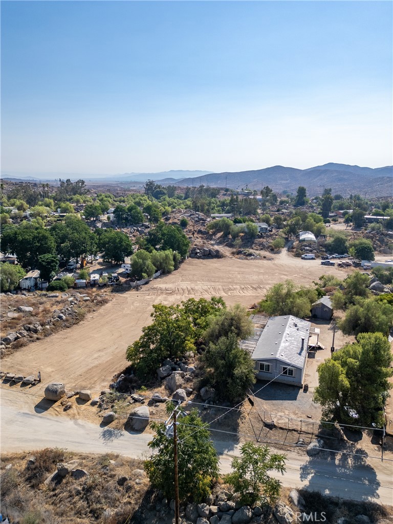ENDLESS POSSIBILITIS! This 3 bed, 2 bath manufactured home sits on nearly 2.5 acres!!! This property has been cleared and ready for its new buyer! While the home may need a little TLC, this land brings many opportunities!! Nestled between Lake Elsinore and Menifee, this property has easy access to freeways, shopping and restaurants. Whether you would like to bring your animals and build a barn, bring your RVs and toys for storage, or simply build an ADU, there’s so much potential! It’s time to make this property yours!
