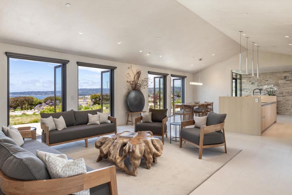 Carmel Coastal Retreat Beside Sea Star Ranch - Set along the Pacific with panoramic ocean vistas, this brand-new modern masterpiece designed by Mary Ann Schicketanz, offers an unparalleled lifestyle rooted in nature and refined in design. Adjacent to Sea Star Ranch, an acclaimed equine sanctuary, this home is a sanctuary unto itself. Glass French doors open to and invite in the seascape, while an open-concept layout flows effortlessly from indoor luxury to outdoor serenity. Highlights include a designer kitchen with top-tier appliances, a serene primary suite with a private ocean-view terrace and spa-like bathroom with sauna, and multiple guest suites for hosting. Smart technology and sustainable features blend seamlessly with timeless coastal aesthetics. Whether a private escape or a full time retreat, this home offers connection to land, sea, and self and just minutes to hiking, beaches, world renowned restaurants and everything downtown Carmel-by-the-Sea has to offer.