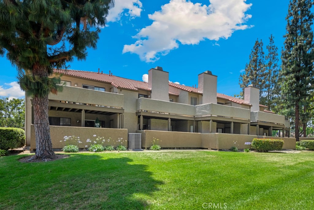 Welcome Home! Freshly updated and move-in ready, this upper-level condo shines with new appliances (stove, microwave, dishwasher, disposal, and A/C), newer flooring, and wood shutters throughout. The bright kitchen features white cabinetry and opens to a spacious living and dining area, leading out to a large private balcony. The roomy bedroom offers dual closets, and the bathroom has been modernized with a sleek vanity and updated fixtures. Additional highlights include in-unit laundry hook-ups, carport parking, and a well-kept, gated community with a pool, spa, and gym. Ideally located near local schools, markets, and dining, this home delivers comfort, style, and convenience — a perfect place to call your own!