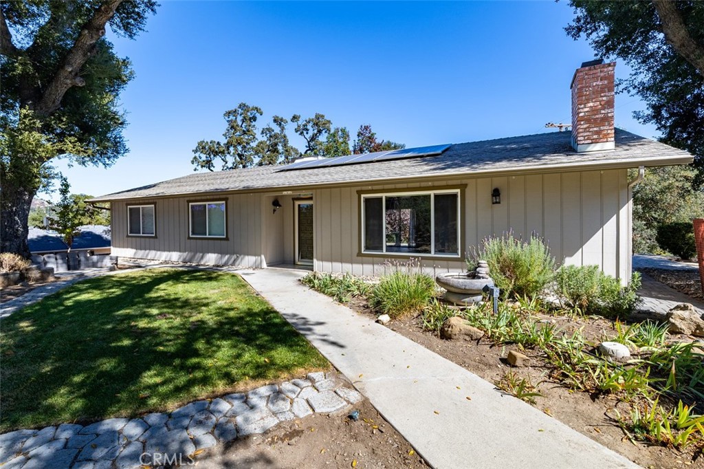 Welcome to 8070 Coromar Avenue, a well-maintained single-level ranch home situated on a spacious 21,600 sq ft lot in a peaceful Atascadero neighborhood. This 3-bedroom, 2-bath residence offers comfort, efficiency, and charm throughout. Step inside to a bright, open floor plan featuring a brick fireplace, large picture windows with custom barn doors, and neutral finishes that create a warm, inviting atmosphere. The kitchen is equipped with stainless steel appliances, white cabinetry, and ample counter space — ideal for both daily living and entertaining. Modern upgrades include paid solar, a tankless water heater, and a new sprinkler line for low-maintenance care. The primary suite provides outdoor access perfect for relaxing or enjoying morning coffee. The property offers room for RV and/or boat parking, two storage sheds, and a private hot tub set among mature oaks and natural landscaping. This home is move-in ready and thoughtfully maintained inside and out. Please note: Some photos have been digitally staged to help illustrate furniture placement and the home's potential.
