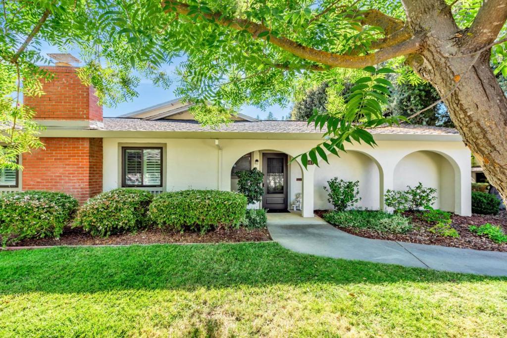 Beautifully home located in the Villages Golf & Country Club, a 55+ community. Notice the hand-crafted artistic glass windows in the hallway, rich hard wood floors, and an elegant new chandelier. Updated kitchen with Corian countertops, tile backsplash, tray ceiling, cabinets accented with frosted, etched-glass inserts. Primary suite with four closets plus a built-in chest of drawers for abundant storage. The main bathroom exudes spa-like luxury with a deep soaker tub, new fixtures, a raised vanity with Kohler sink and hardware, and a modern toilet with integrated bidet, mirrored in the guest bathroom. Additional highlights include energy-efficient dual-pane windows and sliding doors, plantation shutters, and a covered patio with pressed-concrete floor that extends to the walkway leading to Villages Parkway. A thoughtful detail is the preserved acoustic ceiling, a benefit that not only enhances sound absorption for quieter living but also adds a touch of retro-chic character. Start your mornings with a round of golf or a visit to the driving range, enjoy a friendly game of tennis or pickleball, stay active at the fitness center, or simply relax by the pool. The Villages offers endless opportunities for recreation, connection, enjoyment and satisfaction!