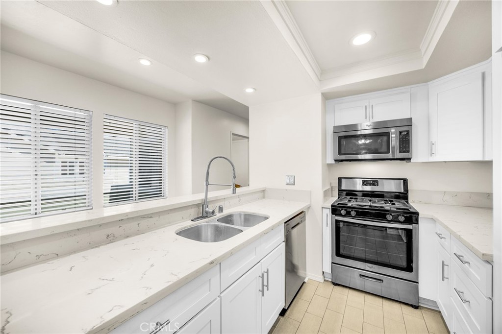 Location, Location! Nestled in a peaceful cul-de-sac in the tranquil canyons of Yorba Linda, this beautifully renovated corner-unit condo offers the perfect blend of privacy, comfort, and modern design. Surrounded by mature trees and natural beauty, this 2-bedroom, 2-bathroom home is a true retreat. Inside, the open-concept layout is enhanced by vaulted ceilings and an abundance of natural light, creating a bright, airy living space. Step onto your private balcony to enjoy your morning coffee or an evening breeze. Thoughtfully updated throughout, the home features laminate flooring, recessed lighting, fresh interior paint, ceiling fans, and a stylish kitchen with custom cabinetry, quartz countertops, and stainless steel appliances. The spacious primary suite includes a custom closet organizer, and a convenient indoor laundry closet with washer/dryer hookups adds everyday ease.
Located in the quiet Yorba Linda Villages community, you'll enjoy resort-style amenities including a sparkling pool, spa, clubhouse, and playground. Outdoor enthusiasts will appreciate the nearby Santa Ana River Trail for walking and biking, while shopping and dining are just minutes away at Savi Ranch. Zoned within the award-winning Yorba Linda School District.
This peaceful end-unit home is ideal for anyone seeking a tranquil lifestyle with easy access to nature and modern conveniences.