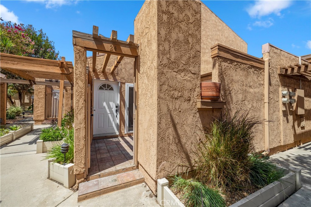 Welcome to 2700 N Brea Blvd Unit 24 located in the City of Fullerton. End unit with no one above or below! As you approach the front door you are immediately greeted by a private patio area ideal for hosting gatherings or just to sit back and relax on your own. You enter this charming dual primary bedroom unit to find a spacious open layout on the main level with a primary bedroom tucked away past the convenient laundry area. Head upstairs to the private 2nd primary bedroom where you will find a spacious walk in closet and vanity area that is separate from the bathroom. This unit includes a carport for 2 vehicles. HOA amenities include community pool area and water/trash service. All of this plus the convenience of a shopping center located just across the street, the property's proximity to the 57fwy and Cal State Fullerton makes this a winner!