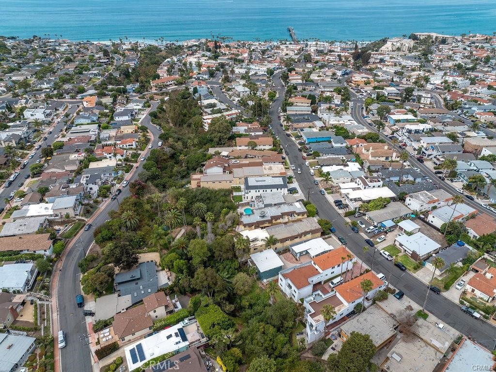 Exceptional 4-Unit Multi-Family Property | Prime San Clemente Location | Ocean & Canyon Views. Discover a rare investment opportunity in the heart of San Clemente! This beautifully upgraded 4-unit multi-family property combines coastal charm, modern enhancements, and unbeatable location. Nestled along a prime street and backing to a serene canyon, this property offers a peaceful retreat just minutes from the best of San Clemente living. Each unit has been tastefully updated with high-quality finishes, offering a turnkey experience for both investors and tenants. The well-maintained and newly upgraded interiors boast stylish kitchens, updated bathrooms, and thoughtful layouts, maximizing comfort and livability. Just blocks from the iconic San Clemente Pier, pristine beaches, and the vibrant shops & restaurants along Avenida Del Mar, this property offers an unmatched blend of natural beauty and urban convenience. Whether you’re looking to expand your portfolio or live in one unit while generating strong rental income from the others, this multi-family gem checks all the boxes. The property consists of two 1 bedroom 1 bath units, 1 studio, and one 2 bedroom 1.5 bath.