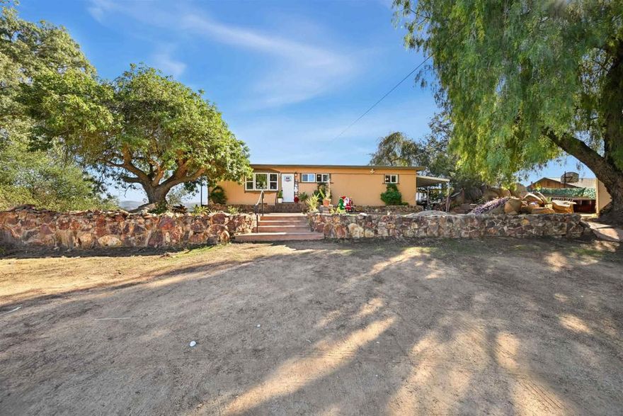 Single-story home on a spacious .59-acre lot in Crest, offering sweeping views of Stoneridge County Preserve. Inside, you’ll find 3 generous bedrooms, 1.5 bathrooms, and a versatile bonus/flex room ideal for an office, hobby space, or additional living area. The property also includes two additional rooms—one located at the front of the home and another at the back featuring a full stand-up bathroom—providing excellent versatility for guest use, work-from-home setups, or multigenerational needs. Original hardwood floors blended with updated vinyl plank flooring add character throughout, and a cozy wood-burning fireplace anchors the living room. Several dual-pane windows enhance comfort and efficiency. Outdoors, the home continues to shine with a covered rear porch, a covered side patio, wide-ranging views in both directions, and plenty of usable space for RV parking, gardening, or creative outdoor projects. A separate front structure adds even more functional possibilities. View Professional Photos and 3D Tour on Saturday, December 19th!!