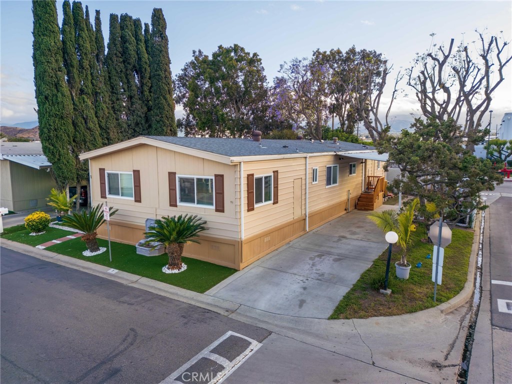 Welcome to 777 S Temescal St #1 – A Stylishly Upgraded Home in the Heart of Corona!
Step into this beautifully renovated 3-bedroom, 2-bath manufactured home offering 1,440 sq ft of modern living space. Fully upgraded for comfort and style, this home features rich hardwood floors, updated kitchen appliances, refreshed cabinetry, and a cozy fireplace perfect for relaxing evenings. The layout flows effortlessly, providing both open-concept living and defined spaces for privacy and functionality.
Enjoy central heating and air, updated lighting fixtures, and ample natural light throughout. The spacious primary suite offers a peaceful retreat with an upgraded en-suite bathroom and generous closet space.
Location is everything—situated in a well-maintained community, you're minutes from the 91 and 15 freeways, shopping centers, parks, and top-rated schools like Santiago High School. The community itself offers desirable amenities including a swimming pool, basketball court, and clubhouse.
This home strikes the perfect balance between affordability, location, and upgraded living. Whether you're downsizing, a first-time buyer, or seeking a smart investment, this move-in-ready gem is worth a look!