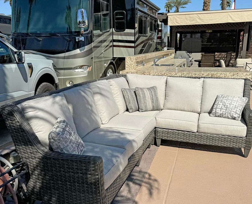 After a fun evening at the clubhouse, retreat to your private oasis at Outdoor Resort Indio. This quiet, perimeter lot is ideal for entertaining, with a spacious outdoor kitchen featuring granite tile countertops, stainless appliances, a large BBQ, and a 10x10 pergola with an aluminum roof. Custom furniture covers, exterior lighting, a ceiling fan, and manual and electric shades ensure comfort and style.The lot accommodates a 45-foot motorcoach and two cars, with tasteful landscaping adding to its charm. Conveniently located near the pool, sauna, and laundry, it combines privacy with easy access to amenities.As a lot owner, you'll also enjoy world-class resort features, including an executive golf course, clubhouse, pickleball courts, and more. This is your opportunity to own a stunning retreat and embrace the luxury RV lifestyle at Outdoor Resort Indio.ORI is a gated Class A RV park. Only class A RVs.