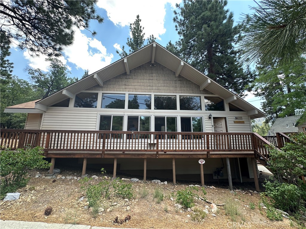 Nestled in the heart of the highly desirable Moonridge neighborhood, this charming Big Bear Lake cabin offers the perfect blend of mountain charm and modern comfort. Set on a generous 9,900 sqft lot, this 3-bedroom, 1.75-bath home features over 1,704 sqft of living space across two levels. The inviting interior showcases rustic wood finishes, a spacious living room with a cozy fireplace, and abundant natural light throughout. Step outside to the expansive deck and take in breathtaking views of the surrounding forest—perfect for relaxing or entertaining.
Located just minutes from Bear Mountain Ski Resort, the Big Bear Alpine Zoo, golf course, and miles of scenic national forest trails, this home provides easy access to year-round outdoor recreation. Moonridge is known for its peaceful mountain atmosphere, crisp pine-scented air, and proximity to local shops, dining, and entertainment. Whether you're hitting the slopes in winter or exploring hiking and biking trails in summer, the Moonridge lifestyle offers the ideal alpine retreat. Whether you're seeking a full-time residence, a vacation getaway, or a prime rental investment, this property is a true mountain escape.