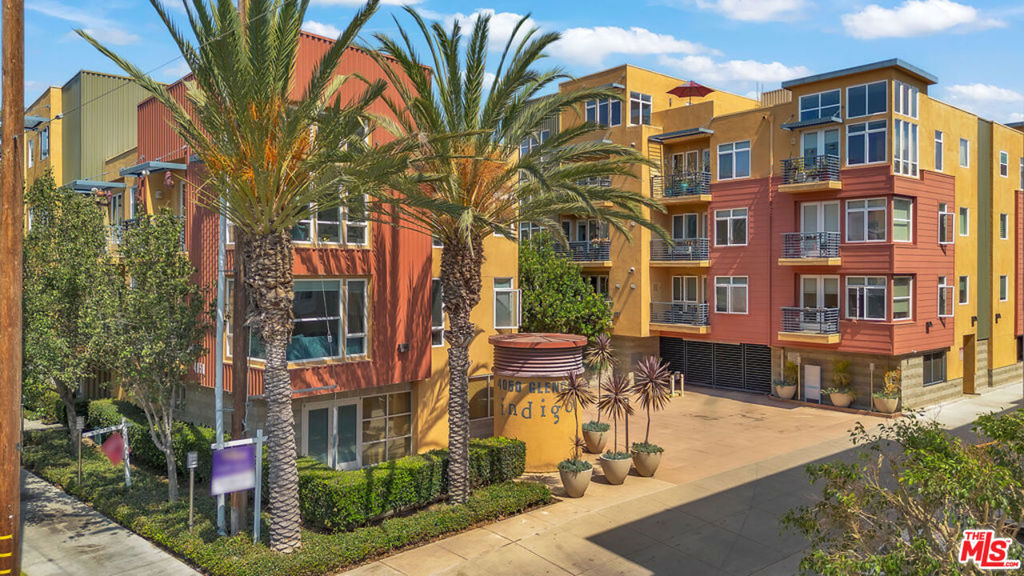 STUNNING TWO-STORY PENTHOUSE WITH VIEWS AND ROOFTOP DECK IN MARINA ARTS DISTRICT INDIGO BUILDING! Just minutes from the beach, this spacious, three bedroom plus den/office, three bathroom unit with nearly 20 foot ceilings features a gourmet kitchen with Viking appliances, granite counters and custom cabinets, and an open dining and living room with fireplace. The first level offers a generous en suite bedroom and a separate den/office. The second level offers two bedrooms and bathrooms, including an enormous primary suite with walk-in custom closets, separate shower and large soaking tub, double sinks, a very large private rooftop deck with city, mountain and sunset views. This very rare and well maintained penthouse boasts great square footage with fabulous views. Building amenities include an impressive gym, meeting room, spa room, two outdoor courtyards with BBQs and fire pit, unit has two assigned parking spaces and plenty of guest parking.