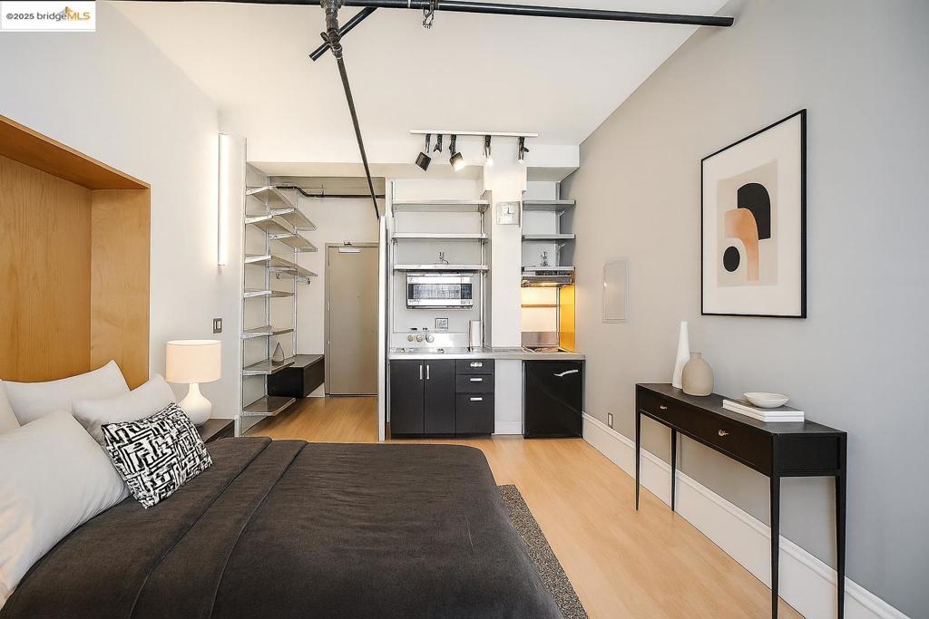 Experience classic architecture blended with modern urban living in this beautifully renovated studio, located in the historic Book Concern Building in the heart of San Francisco. Originally constructed in 1908 and thoughtfully reimagined in 2007, this iconic landmark offers a unique blend of character and contemporary style. The studio features soaring ceilings, hardwood flooring, sleek stainless steel finishes, and an oversized window that frames city views and fills the space with natural light. Murphy bed included! Residents enjoy a range of amenities, including a rooftop deck with panoramic downtown views, a fitness center, rec/game room, laundry facilities, and secure bike storage. A rare find in a prime location, just steps from the beloved Arsicault Bakery.