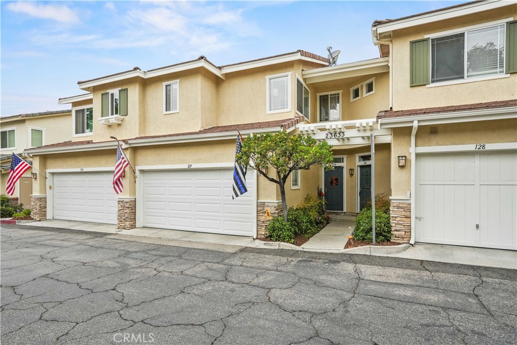 Discover this beautifully updated, model-perfect two-story townhome located in the desirable Montana community of Valencia. Designed with both style and functionality in mind, this home boasts abundant natural light and a thoughtful floor plan.
The chef’s kitchen features quartz countertops with matching backsplash, bar seating, stainless steel appliances, and generous cabinet space. The inviting living room offers a built-in entertainment center and a cozy fireplace, while upgraded flooring runs throughout the home. A convenient guest bathroom is also located on the main level.
Upstairs, the spacious primary suite showcases vaulted ceilings and a spa-inspired bathroom with dual vessel sinks, walk-in closet, granite countertops, and a walk-in shower. The secondary bedroom features high ceilings and its own en-suite bathroom with granite vanity and tub/shower combo. An office nook with granite workspace provides the perfect spot for working from home.
The entertainer’s backyard is a private retreat with lush landscaping and a full outdoor kitchen complete with barbecue, flat-top grill, sink and refrigerator. Additional highlights include LED lighting, direct access to a two-car garage, and a newer roof.
Residents of the Montana community enjoy exceptional amenities including a pool and spa, with water and trash utilities included in the HOA. Ideally located near top-rated schools, parks, shopping, dining, and more, this home offers the best of Valencia living.
Welcome home!