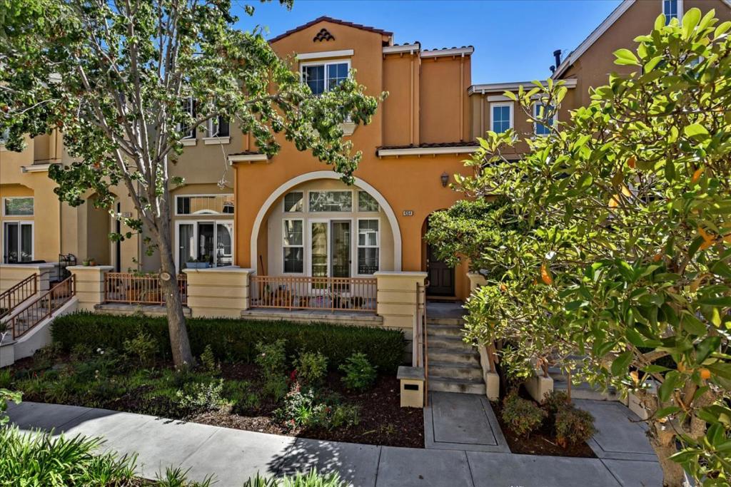 SECURITY, PRIVACY, & COMFORT ELEGANT FINISHES | QUIET SURROUNDINGS This townhome nestled in a serene corner of the Rivermark community provides a calm, easily accessible setting and plenty of modern comforts. A handsome fireplace with art niche centers the living room, which is overlooked by a flexible family/dining room and opens to a private patio for easy entertaining. Stainless appliances, granite-slab countertops, and task lights lend style and function to the light-filled kitchen, and an adjacent breakfast area is perfect for casual dining. Upstairs are three well-appointed bedrooms and a convenient laundry. The serene master suite boasts a luxury bath with dual vanities, soaking tub, separate shower, and beautiful stone finishes. Other highlights include central AC and an attached two-car garage. Stroll over to Live Oak Park, trails, and Don Callejon School (K-8). Moments from Rivermark Village, Levis Stadium, Oracle, Intel, and much more!