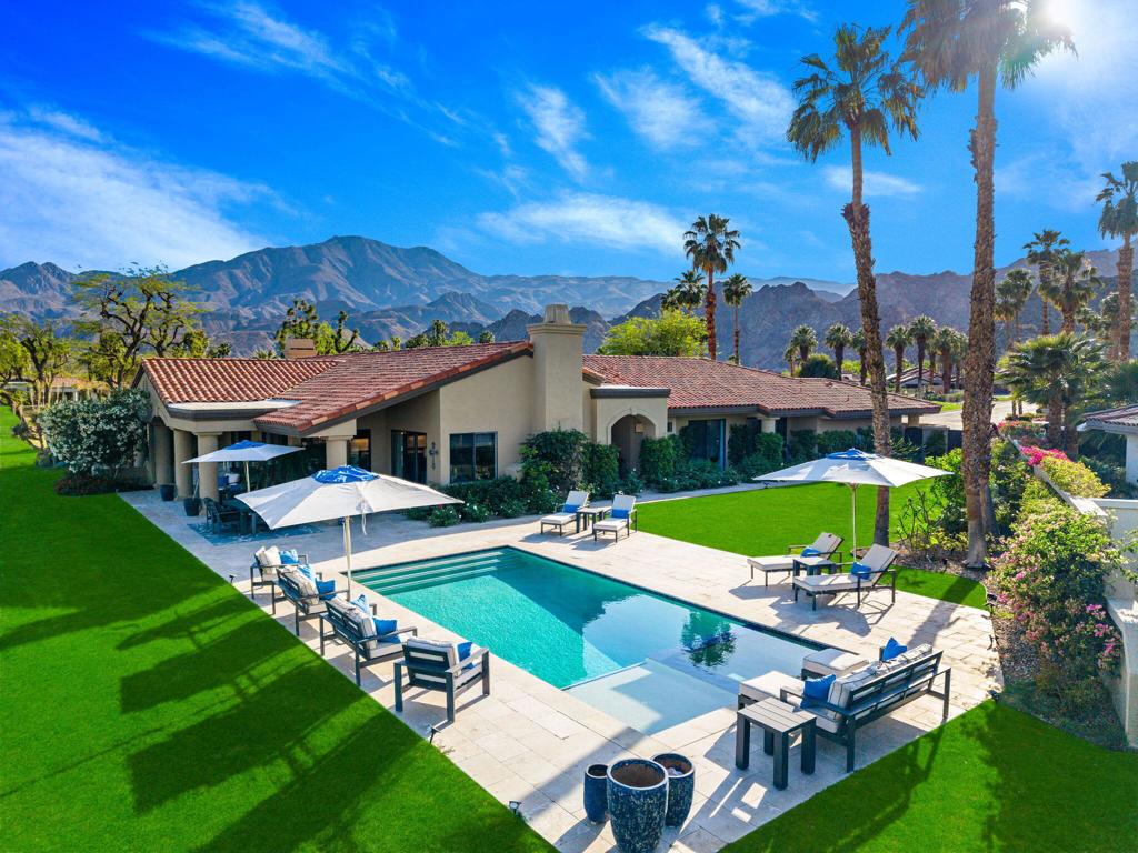 This Point lot is overlooking the triple fairways of #1, 9, & 18 of the Nicklaus Private Course. With far reaching views, the Point lot boasts Western sunsets, Eastern morning sun, Southern mountains, & the Northern desert! The oversized lot has amazing entertainment space with a beautiful saltwater pool & spa, expansive travertine patios offering unencumbered panoramic views. The interior of this home, detailed by the pictures is simply stunning! Tall vaulted ceilings, beautiful modern flooring with an architecturally designed fireplace enhancing the beauty of this home. Spacious kitchen with abundant storage & pull out pantry to enhance any chef's dreams. Large island with waterfall feature stands as an entertaining space or work area. This Legends 40 has been completely renovated to bring a contemporary open floor plan & maximize views of the outdoor living spaces. There are 2 separate living areas off the kitchen, 3 large bedrooms, all with en-suites, making this property ideal for weekend getaways or a full time residence. Throughout you will find natural stone in the primary, & secondary baths, with waterfall counter tops & Rohl polished nickel fixtures. The bathrooms also feature walls beautifully accented with wallpaper. Our desert is meant for enjoying early morning sun & warm summer nights. The outdoor entertaining space indulges those desires. Envision yourself through the outdoor pictures, relaxing, entertaining, & enjoying your new home!
