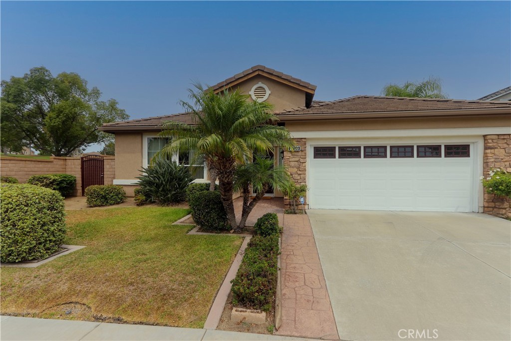 Welcome to 1203 Castner Dr, Placentia, CA — a stunning single-story residence built in 2006, nestled in the highly sought-after Rosecrest community. This beautifully maintained 3-bedroom, 2-bath home offers 2,222 sq. ft. of living space on a 6,246 sq. ft. lot, ideally located near a golf course and shopping center.
Step inside to a spacious formal living room that flows seamlessly into the dining area, perfect for gatherings and entertaining. The open-concept kitchen and family room feature abundant cabinetry, granite countertops, a central island with dining space, and a bright window above the sink that fills the room with natural light. The inviting family room boasts a cozy fireplace with a mantle, an entertainment niche, and sliding doors that open to the tranquil backyard.
The primary suite is a private retreat with direct patio access, a luxurious spa-style bath with dual vanities, a soaking jacuzzi tub, a separate shower, a walk-in closet, and an additional mirrored closet at the entry.
Additional highlights include a separate laundry room with a built-in sink, plantation shutters in two bedrooms, custom built-in closet organizers in all bedrooms, built-in garage cabinets, a water softener, and an attached garage. The home is enhanced with custom crown molding, baseboards, elegant drapery, wood blinds, porcelain tile flooring, and plush carpeting.
Outside, enjoy a beautifully landscaped, low-maintenance backyard designed for both relaxation and entertaining.
Built by S&S Homes, first time on the market, this property is offering a rare opportunity to own a spacious, well-appointed home in a prime Placentia location.
