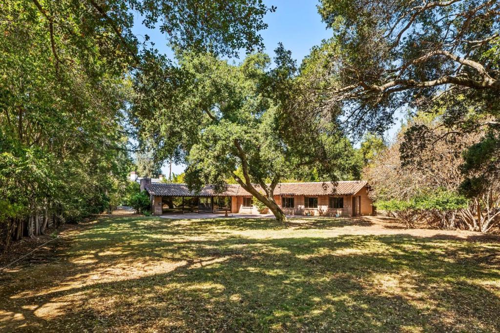 Prime close to town location! Move in, use as income property, or build new. This mid-century modern one-level home has been in one family for 68 years and was built using gorgeous first growth timbers and many innovative concepts. The private, park-like setting with mature fruit trees spans over 1 acre yet is just blocks to downtown Los Altos. The interior featuring 4 bedrooms and 3 bathrooms, an open kitchen/living room, separate family room and vaulted wooden ceilings, is both spacious and warm. Survey completed by Lea and Braze Engineering provides MFA of 5,727 sf and MDA of 13,432 sf. In the finest location so close to downtown Los Altos, beautiful parks, nature preserves, and so much more. Properties such as this rarely become available!