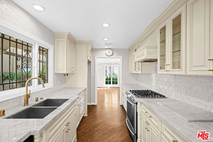 Set on iconic, palm-lined South Palm Drive, this two-story Beverly Hills home offers 5 bedrooms and 5 baths across just under 3,800 sq-ft. Thoughtfully updated and wonderfully bright, the residence blends classic charm with modern comfort. A sun-filled main level flows from formal living to dining and into a remodeled kitchen with generous cabinetry and prep space. Multiple gathering areas create an easy backdrop for everyday living and entertaining. Upstairs, well-proportioned bedrooms include a spacious primary suite; additional bedrooms and baths provide excellent flexibility for guests, office, or playroom needs. Large windows and exposures on multiple sides invite natural light throughout the day. Located on one of the few streets outside the Beverly Hills Flats lined with soaring palms, the home sits moments from renowned dining, shopping, and neighborhood parks. A rare lease opportunity in a quintessential Beverly Hills setting.