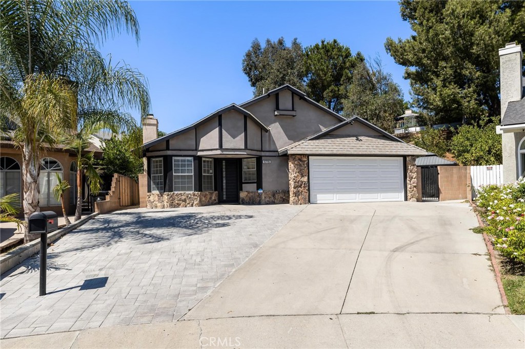 Welcome to 11715 Garrick Ave. - A Stylish, Move-In Ready Home with Stunning Mountain Views. Tucked away at the end of a quiet cul-de-sac, this beautifully updated single-story home sits on an expansive 10,000+ sq. ft. lot, offering the perfect blend of style, comfort, and outdoor entertaining space. Featuring 3 bedrooms and 2 bathrooms, the home boasts a light-filled open floor plan with vaulted ceilings, recessed lighting, gleaming wood laminate floors, dual pane windows, and a cozy fireplace that anchors the inviting living room. The stunning kitchen is a chef’s dream, complete with sleek quartz countertops, stainless steel appliances, an abundance of cabinetry, and a convenient breakfast bar that flows seamlessly into the dining area. The spacious primary suite includes a private bath, vaulted ceiling, generous closet space, and a sliding glass door that opens to the backyard. Step outside to your private entertainer’s paradise - a beautifully landscaped backyard featuring a large patio, a covered cabana-style dining area with ceiling fan, multiple fruit trees, and plenty of room to relax or host guests. Additional highlights include: Central air and heat, Nest thermostat & Ring security system, direct-access 2-car garage with large driveway with ample parking, and low-maintenance landscaping. This home is truly a rare find - offering comfort, and convenience, all in a desirable neighborhood. Don’t miss your opportunity to make it yours!