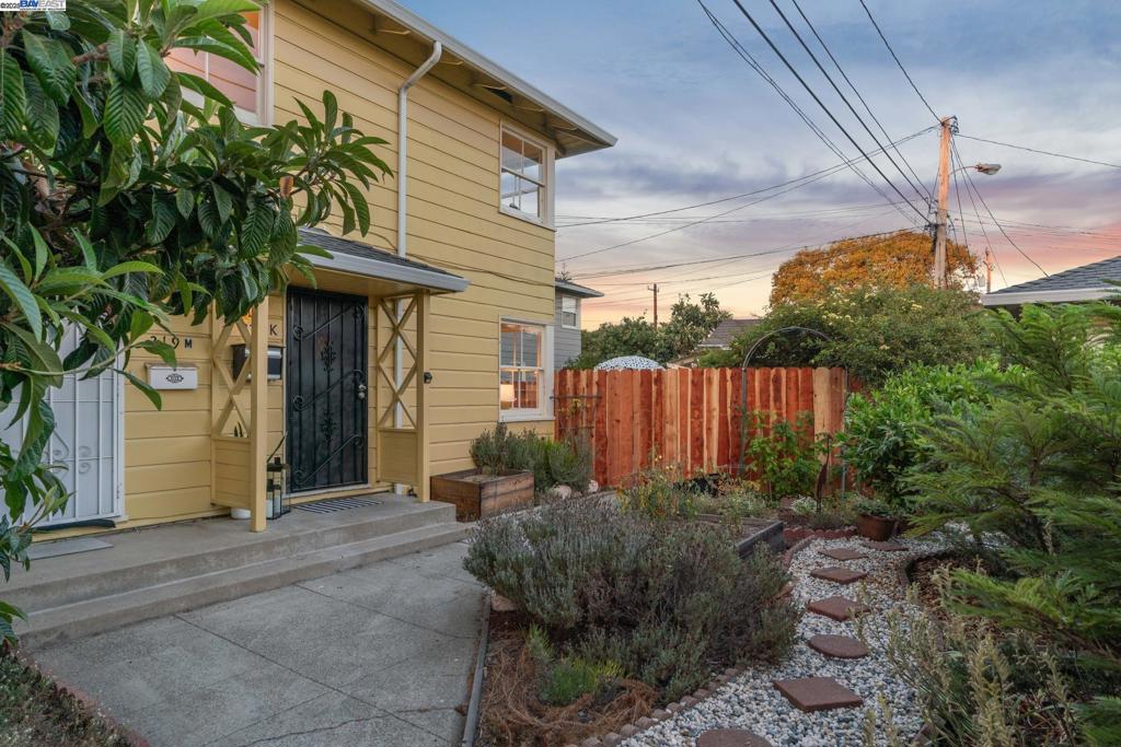 Discover a charming 3BD/1.5BA jewel box with large private yard and separate bonus space in Alameda’s historic Woodstock co-op. Located on the thriving West End, this 894 SQFT home lives larger with a thoughtful layout, ample outdoor space, and a separate building to work from home. Step inside the cheery living area where sunshine splashes across the room, built-in shelving gives a cozy feel, and windows look onto the community lawn and private garden. A renovated powder room adds convenience to the floor. The eat-in kitchen enjoys updated cabinets, appliances and counters, plus a laundry area and a door to the spacious backyard for lovely indoor/outdoor living. Surrounded by mature landscaping, dine al fresco, garden in the raised beds, unwind on the patio, or work in the bonus structure. Back inside, the sunny bedrooms are tucked away for privacy and quiet on the upper floor. All have good closets and share an upgraded full-bath. There’s dedicated parking on the street, and you’re close to the ferry for an easy commute to SF. Down the road, find respected K-12 public schools, lively Alameda Point with its dining, wineries and ferry to SF, Webster Street shops and restaurants, and the glorious Alameda coast with its beaches and miles of shoreline trails.