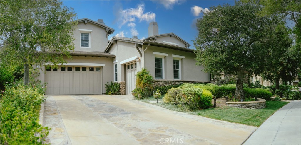 Beyond Gates of Covenant Hills, a 24hr guard gated community, 15 Pisano is Situated on a single-loaded cul-de-sac street .This stunning Craftsman semi-custom estate that blends timeless elegance with modern functionality, set against serene canyon and hillside sunset views. Recently appraised at $3.3 million, this exceptional home was built by K. Hovnanian, and sits on a 9,800 sqft lot. This home offers 4,600 sqft of beautifully curated living space, including 5 bedrooms and 4.5 bathrooms. High ceilings and Richard Marshall wood flooring enhance the home’s open, light-filled layout. The chef’s kitchen features a 48” Wolf double oven range, 42” Sub-Zero fridge, custom cabinetry, oversized center island, walk-in pantry, and butler’s station connecting to the formal dining room. The kitchen flows into the casual dining area and spacious family room with fireplace. The formal living and dining room open to a private interior courtyard with fireplace, leading to a separate one-bedroom en-suite casita ideal for guests, family, or a home office. Upstairs, four spacious bedrooms and a bonus room/children’s retreat with French doors open to the courtyard. The luxurious primary suite offers a sitting area with fireplace, dual walk-in closets, spa-like soaking tub, and oversized walk-in shower. The professionally landscaped backyard is perfect for entertaining, with a covered outdoor kitchen, BBQ, bar seating, mature fruit trees, and private retreat-like space. Additional features include a spacious laundry room, soft water system, newer water heater and dual furnaces, and a large 3-car garage as well as a separate 4th garage which could be converted into an office or additional bedroom. Near Covenant Hills’ clubhouse, pool, tennis courts, scenic trails, and top-rated schools, 15 Pisano offers access to all Ladera Ranch amenities, including 25 parks, 14 pools, 7 hiking trails, 6 tennis courts, 4 clubhouses, pickleball courts, dog park, skate park, water park, and more. This is Southern California living at its finest in one of Orange County’s most sought-after communities.