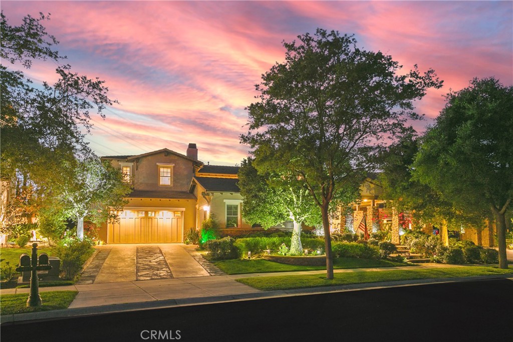 Situated on a single-loaded cul-de-sac in the 24-hour guard-gated community of Covenant Hills, 15 Pisano is a stunning Craftsman semi-custom estate that blends timeless elegance with modern functionality, set against serene canyon and hillside sunset views. Built by K. Hovnanian, this impressive home sits on a 9,800 sqft lot and offers 4,600 sqft of beautifully curated living space, including 5 bedrooms and 4.5 bathrooms. High ceilings and Richard Marshall wood flooring enhance the home’s open, light-filled layout. The chef’s kitchen features a 48” Wolf double oven range, 42” Sub-Zero fridge, custom cabinetry, oversized center island, walk-in pantry, and butler’s station connecting to the formal dining room. The kitchen flows into the casual dining area and spacious family room with fireplace. The formal living and dining room open to a private interior courtyard with fireplace, leading to a separate one-bedroom en-suite casita ideal for guests, family, or a home office. Upstairs, four spacious bedrooms and a bonus room/children’s retreat with French doors open to the courtyard. The luxurious primary suite offers a sitting area with fireplace, dual walk-in closets, spa-like soaking tub, and oversized walk-in shower. The professionally landscaped backyard is perfect for entertaining, with a covered outdoor kitchen, BBQ, bar seating, mature fruit trees, and private retreat-like space. Additional features include a spacious laundry room, soft water system, newer water heater and dual furnaces, and a large 4-car garage. Near Covenant Hills’ clubhouse, pool, tennis courts, scenic trails, and top-rated schools, 15 Pisano offers access to all Ladera Ranch amenities, including 25 parks, 14 pools, 7 hiking trails, 6 tennis courts, 4 clubhouses, pickleball courts, dog park, skate park, water park, and more. This is Southern California living at its finest in one of Orange County’s most sought-after communities.
